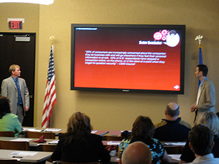 Mark & Jeff Speaking during a presentation