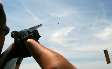 Marksman shooting a clay pigeon